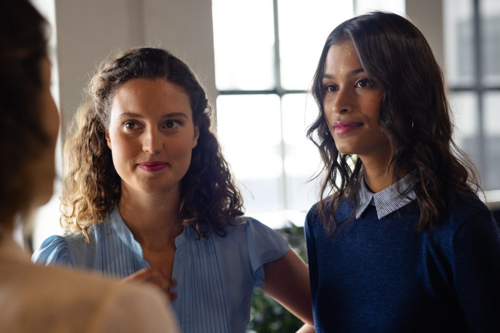 Diverse female colleagues in discussion in casual office meeting